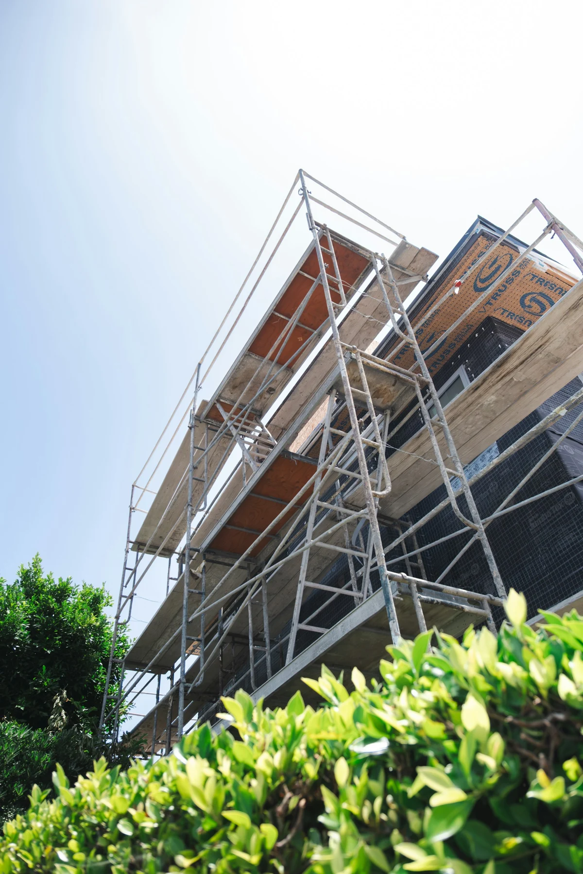 Scaffolding surrounding a building under construction